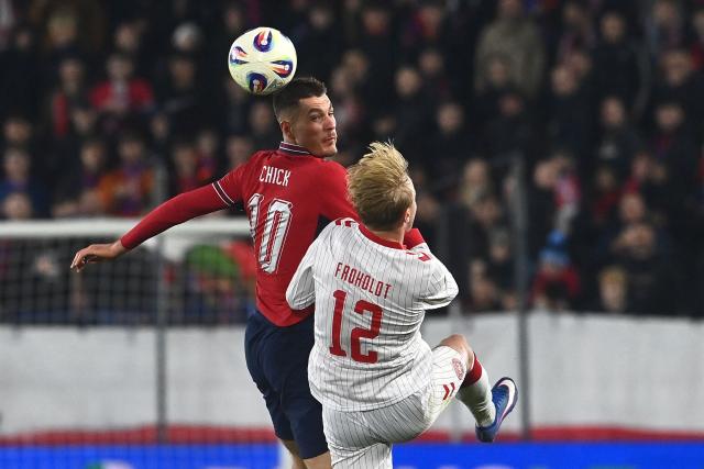 Czech Republic's forward #10 Patrik Schick (C, L) and Denmark's midfielder #12 Victor Froholdt (C, R) vie for the ball during the FIFA World Cup 2026 European qualification final football match Czech Republic vs Denmark on March 31, 2026 in Prague, Czech Republic. (Photo by Michal Cizek / AFP)