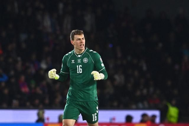 Czech Republic's goalkeeper #16 Lukas Hornicek celebrates after his team scored the equalizing goal 1-1 during the FIFA World Cup 2026 European qualification final football match Czech Republic vs Denmark on March 31, 2026 in Prague, Czech Republic. (Photo by Michal Cizek / AFP)