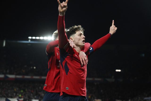Czech Republic's defender #07 Ladislav Krejci (R) celebrates with Czech Republic's midfielder #15 Pavel Sulc after scoring the 2-1 goal during the first period of extra time during the FIFA World Cup 2026 European qualification final football match Czech Republic vs Denmark on March 31, 2026 in Prague, Czech Republic. (Photo by Michal Cizek / AFP)