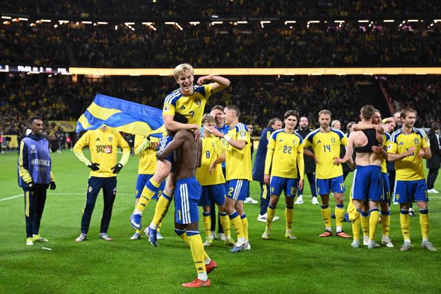 Sweden's players celebrate after winning 3:2 the FIFA World Cup 2026 European qualification final football match between Sweden and Poland in Solna, Sweden, on March 31, 2026. (Photo by Jonathan Nackstrand / AFP)