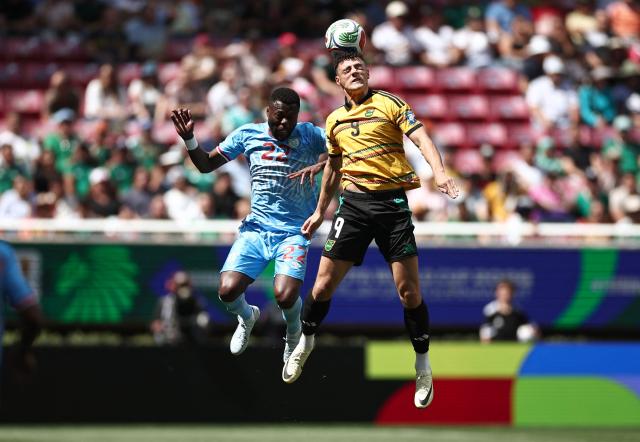 DR Congo's defender #22 Chancel Mbemba and Jamaica's forward #09 Bailey Cadamarteri jump to head the ball during the 2026 FIFA World Cup qualifiers final playoff football match between the Democratic Republic of the Congo and Jamaica at the Akron Stadium in Zapopan, Jalisco state, Mexico, on March 31, 2026. (Photo by Ulises Ruiz / AFP)