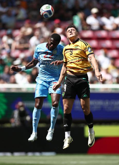 DR Congo's defender #22 Chancel Mbemba and Jamaica's forward #09 Bailey Cadamarteri jump to head the ball during the 2026 FIFA World Cup qualifiers final playoff football match between the Democratic Republic of the Congo and Jamaica at the Akron Stadium in Zapopan, Jalisco state, Mexico, on March 31, 2026. (Photo by Ulises Ruiz / AFP)