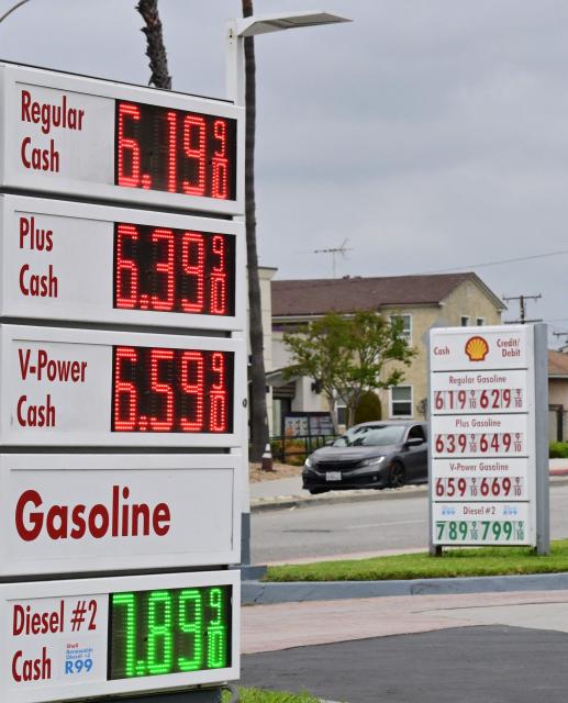 Gas prices are displayed at a Shell station in Los Angeles, California, on March 31, 2026, as US gasoline prices reach their highest level since 2022, following a roughly 30 percent increase in recent weeks. Inflation expectations among US consumers surged in March to levels last seen around seven months ago, following rocketing energy prices due to war in the Middle East, survey data showed March 31. The report is being monitored for how American households respond to price pressures as gasoline costs jump after US-Israeli strikes on Iran plunged the region into war. California is home to the nation's highest gas prices, costing some $1.80-$1.90 higher than the US average which just crossed $4.00 per gallon. (Photo by Frederic J. BROWN / AFP)