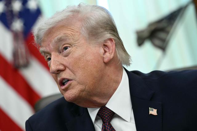 US President Donald Trump speaks to the press after signing an executive order in the Oval Office of the White House in Washington, DC, on March 31, 2026. (Photo by Brendan SMIALOWSKI / AFP)