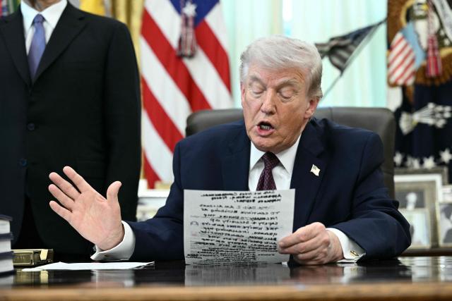 US President Donald Trump speaks to the press after signing an executive order in the Oval Office of the White House in Washington, DC, on March 31, 2026. (Photo by Brendan SMIALOWSKI / AFP)
