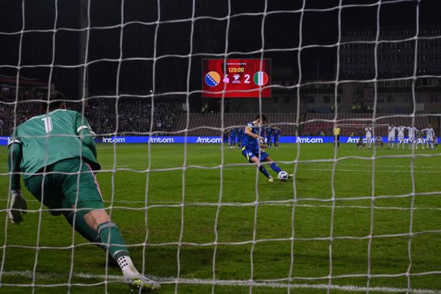 TOPSHOT - Bosnia-Herzegovina's forward #20 Esmir Bajraktarevic kicks the ball and scores during the penalty shoot-out during the FIFA World Cup 2026 European qualification final football match between Bosnia-Herzegovina and Italy at the Bilino-Polje stadium in Zenica on March 31, 2026. (Photo by Elvis BARUKCIC / AFP)