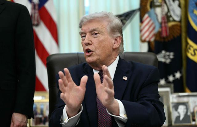 US President Donald Trump speaks after he signed an executive order in the Oval Office of the White House in Washington, DC, on March 31, 2026. (Photo by Brendan SMIALOWSKI / AFP)