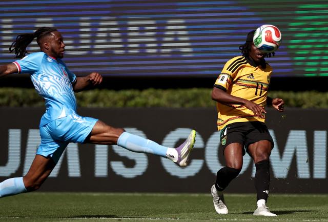 DR Congo's defender #02 Aaron Wan-Bissaka (L) and Jamaica's forward #11 Tyreece Campbell fight for the ball during the 2026 FIFA World Cup qualifiers final playoff football match between the Democratic Republic of the Congo and Jamaica at the Akron Stadium in Zapopan, Jalisco state, Mexico, on March 31, 2026. (Photo by Ulises Ruiz / AFP)