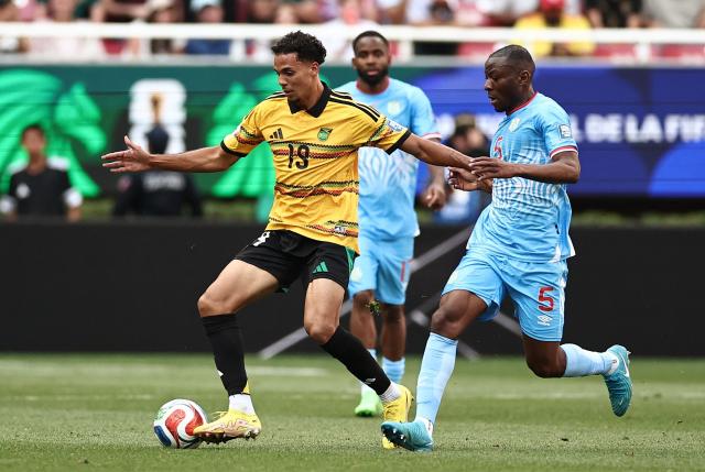 Jamaica's defender #19 Ian Fray and DR Congo's midfielder #05 Edo Kayembe fight for the ball during the 2026 FIFA World Cup qualifiers final playoff football match between the Democratic Republic of the Congo and Jamaica at the Akron Stadium in Zapopan, Jalisco state, Mexico, on March 31, 2026. (Photo by Ulises Ruiz / AFP)