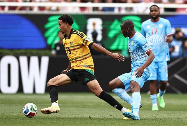Jamaica's defender #19 Ian Fray and DR Congo's midfielder #05 Edo Kayembe fight for the ball during the 2026 FIFA World Cup qualifiers final playoff football match between the Democratic Republic of the Congo and Jamaica at the Akron Stadium in Zapopan, Jalisco state, Mexico, on March 31, 2026. (Photo by Ulises Ruiz / AFP)