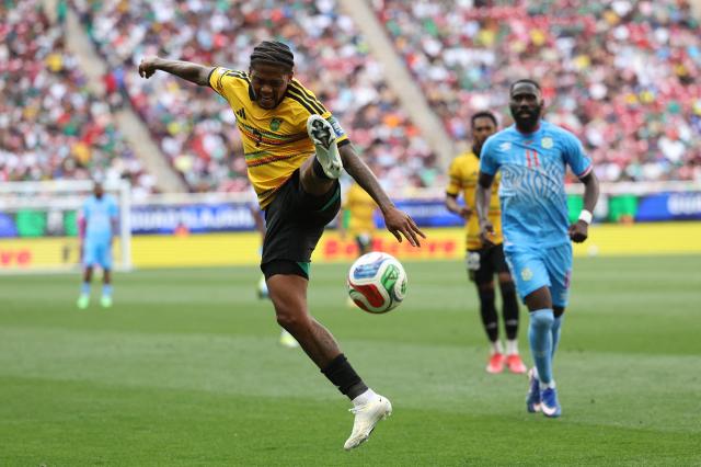 Jamaica's midfielder #07 Leon Bailey controls the ball past DR Congo's defender #11 Arthur Masuaku during the 2026 FIFA World Cup qualifiers final playoff football match between the Democratic Republic of the Congo and Jamaica at the Akron Stadium in Zapopan, Jalisco state, Mexico, on March 31, 2026. (Photo by Ulises Ruiz / AFP)