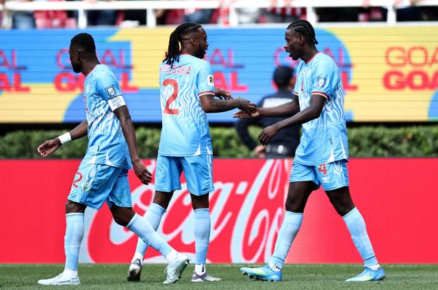 DR Congo's defender #04 Axel Tuanzebe (R) celebrates with teammate defender #02 Aaron Wan-Bissaka after scoring a goal in overtime during the 2026 FIFA World Cup qualifiers final playoff football match between the Democratic Republic of the Congo and Jamaica at the Akron Stadium in Zapopan, Jalisco state, Mexico, on March 31, 2026. (Photo by Ulises Ruiz / AFP)