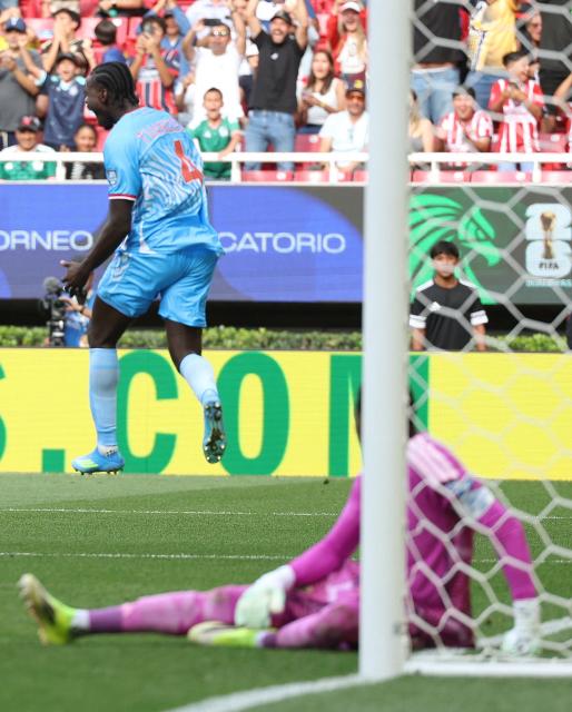 DR Congo's defender #04 Axel Tuanzebe celebrates after scoring a goal in extra time during the 2026 FIFA World Cup qualifiers final playoff football match between the Democratic Republic of the Congo and Jamaica at the Akron Stadium in Zapopan, Jalisco state, Mexico, on March 31, 2026. (Photo by Ulises Ruiz / AFP)