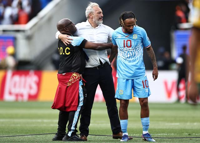 DR Congo's French head coach Sebastien Desabre (C) celebrates with midfielder #10 Theo Bongonda and with a member of the technical staff after winning the match and qualifying for the World Cup during the 2026 FIFA World Cup qualifiers final playoff football match between the Democratic Republic of the Congo and Jamaica at the Akron Stadium in Zapopan, Jalisco state, Mexico, on March 31, 2026. (Photo by Ulises Ruiz / AFP)