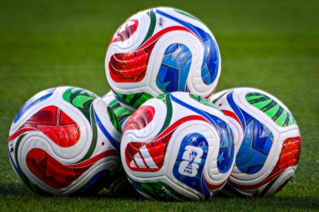 FIFA game balls are seen on the field ahead of a friendly football match between Brazil and Croatia at Camping World Stadium in Orlando, Florida, on March 31, 2026. (Photo by Miguel J. Rodriguez CARRILLO / AFP)