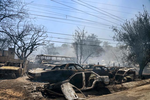 Destroyed cars are pictured on a lot where impounded vehicles are stored in San Antonio, Acapulco, Guerrero state, Mexico on March 31, 2026. According to the General Coordination of Civil Protection and Firefighters of Acapulco, around 400 vehicles were destroyed by the fire. (Photo by Francisco ROBLES / AFP)