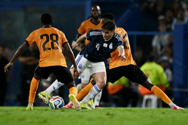 Zambia's midfielder #28 David Simukonda, Argentina's forward #09 Julian Alvarez, and Zambia's midfielder #12 Wilson Chisala fight for the ball during a friendly football match between Argentina and Zambia at La Bombonera stadium in Buenos Aires on March 31, 2026. (Photo by Luis ROBAYO / AFP)