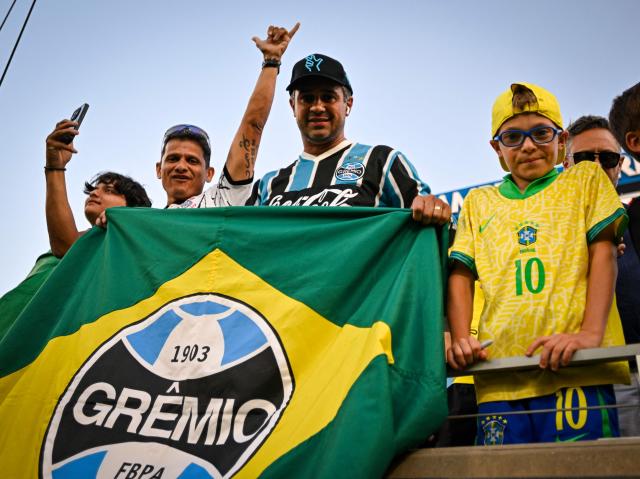 Brazil fans cheer ahead of a friendly football match between Brazil and Croatia at Camping World Stadium in Orlando, Florida, on March 31, 2026. (Photo by Miguel J. Rodriguez CARRILLO / AFP)