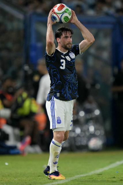 Argentina's defender #03 Nicolas Tagliafico takes a throw-in during a friendly football match between Argentina and Zambia at La Bombonera stadium in Buenos Aires on March 31, 2026. (Photo by JUAN MABROMATA / AFP)