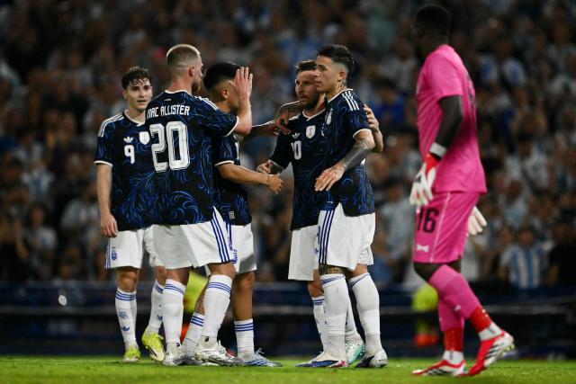 Argentina's forward #10 Lionel Messi (C) celebrates with teammates after scoring his team's second goal during a friendly football match between Argentina and Zambia at La Bombonera stadium in Buenos Aires on March 31, 2026. (Photo by Luis ROBAYO / AFP)