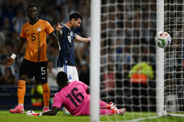 TOPSHOT - Argentina's forward #10 Lionel Messi celebrates scoring his team's second goal past Zambia's defender #05 Tinkler Sinkala and goalkeeper #16 Willard Mwanza during a friendly football match between Argentina and Zambia at La Bombonera stadium in Buenos Aires on March 31, 2026. (Photo by Luis ROBAYO / AFP)