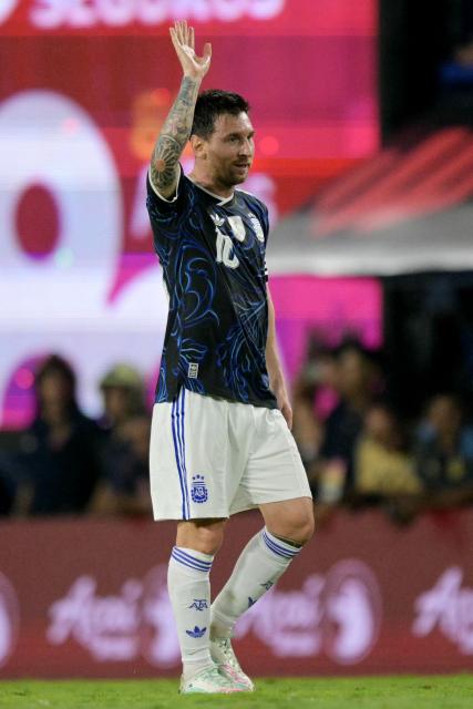 Argentina's forward #10 Lionel Messi waves to fans during a friendly football match between Argentina and Zambia at La Bombonera stadium in Buenos Aires on March 31, 2026. (Photo by JUAN MABROMATA / AFP)