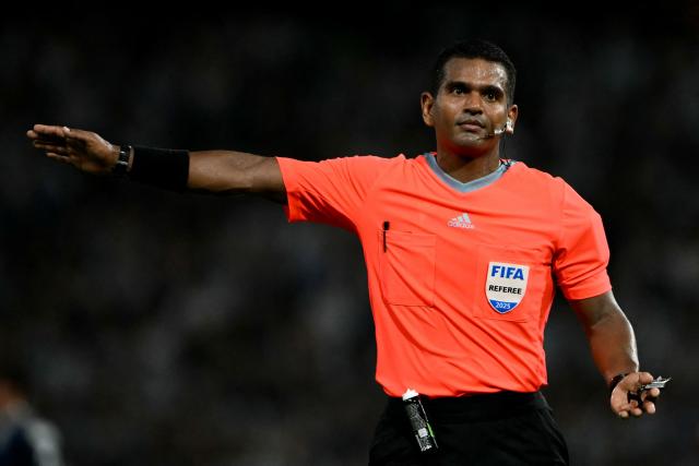 Venezuelan referee Alexis Herrera gestures during a friendly football match between Argentina and Zambia at La Bombonera stadium in Buenos Aires on March 31, 2026. (Photo by Luis ROBAYO / AFP)