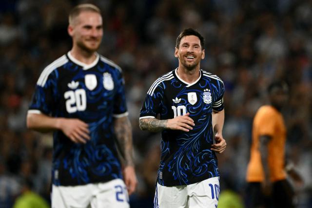 Argentina's forward #10 Lionel Messi celebrates after his team's third goal scored by defender #19 Nicolas Otamendi during a friendly football match between Argentina and Zambia at La Bombonera stadium in Buenos Aires on March 31, 2026. (Photo by Luis ROBAYO / AFP)