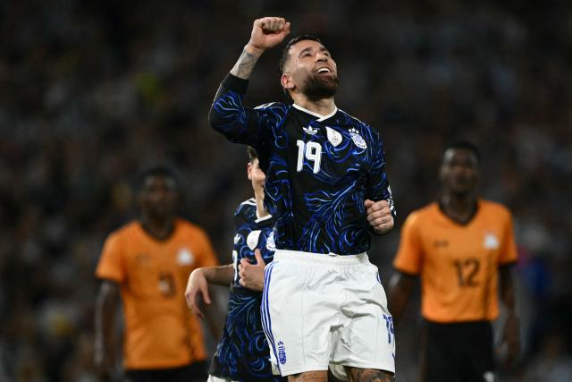 Argentina's defender #19 Nicolas Otamendi celebrates scoring his team's third goal during a friendly football match between Argentina and Zambia at La Bombonera stadium in Buenos Aires on March 31, 2026. (Photo by Luis ROBAYO / AFP)