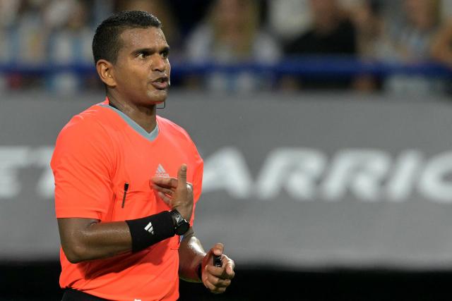 Venezuelan referee Alexis Herrera gestures during a friendly football match between Argentina and Zambia at La Bombonera stadium in Buenos Aires on March 31, 2026. (Photo by JUAN MABROMATA / AFP)