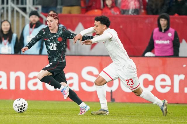 Canada's midfielder #26 Marcelo Flores controls the ball while Tunisia's forward #23 Sayfallah Ltaief defends during a friendly between Canada and Tunisia at BMO Field in Toronto, Ontario on March 31, 2026. (Photo by Geoff Robins / AFP)