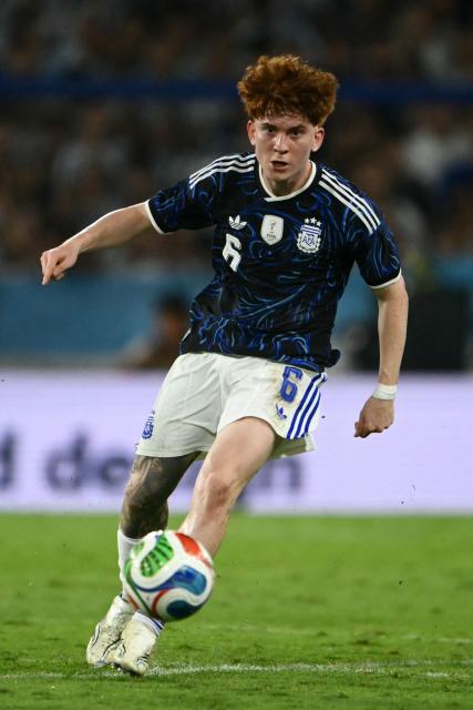 Argentina's defender #06 Valentin Barco kicks the ball during a friendly football match between Argentina and Zambia at La Bombonera stadium in Buenos Aires on March 31, 2026. (Photo by Luis ROBAYO / AFP)