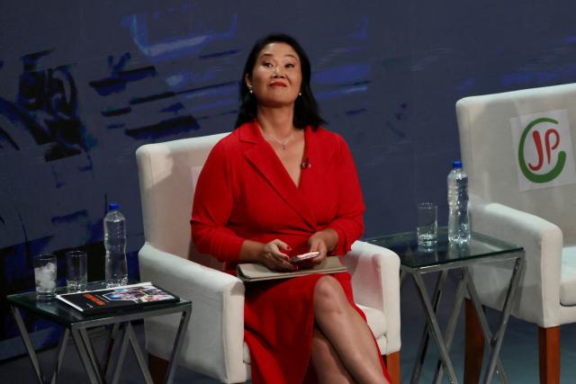 Peru's presidential candidate Keiko Fujimori, for the Fuerza Popular party gestures during the second round of debates on education and employment at the Lima Convention Center in Lima on March 31, 2026. Peru will hold presidential elections on April 12. (Photo by Connie FRANCE / AFP)