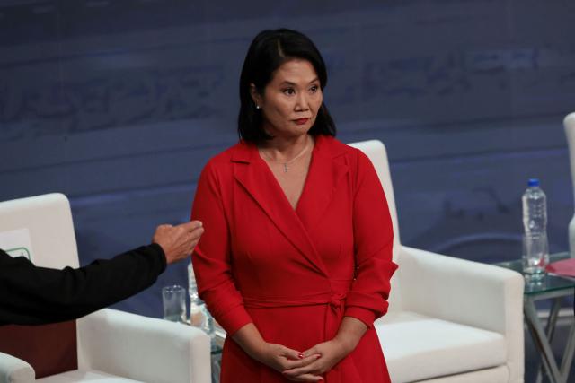 Peru's presidential candidate Keiko Fujimori, for the Fuerza Popular party gestures during the second round of debates on education and employment at the Lima Convention Center in Lima on March 31, 2026. Peru will hold presidential elections on April 12. (Photo by Connie FRANCE / AFP)