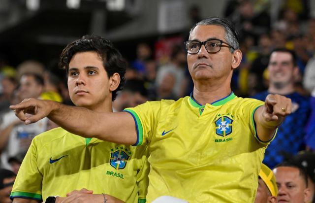 Brazil fans react during a friendly football match between Brazil and Croatia at Camping World Stadium in Orlando, Florida, on March 31, 2026. (Photo by MIGUEL J RODRIGUEZ CARRILLO / AFP)