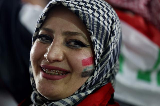 An Iraqi fan smiles ahead of the 2026 FIFA World Cup qualifiers final playoff football match between Iraq and Bolivia at the BBVA Stadium in Guadalupe, Nuevo Leon state, Mexico, on March 31, 2026. (Photo by Julio Cesar AGUILAR / AFP)