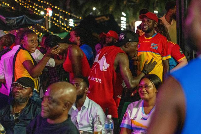 Congolese supporters react as they watch a broadcast from Zapopan, Jalisco state in Mexico, of the 2026 FIFA World Cup qualifiers final playoff football match between the Democratic Republic of the Congo and Jamaica, in Kinshasa early on April 1, 2026. The Democratic Republic of Congo defeated Jamaica 1-0 after extra time in an intercontinental playoff on March 31 to seal their first World Cup appearance in 52 years. (Photo by Glody MURHABAZI / AFP)