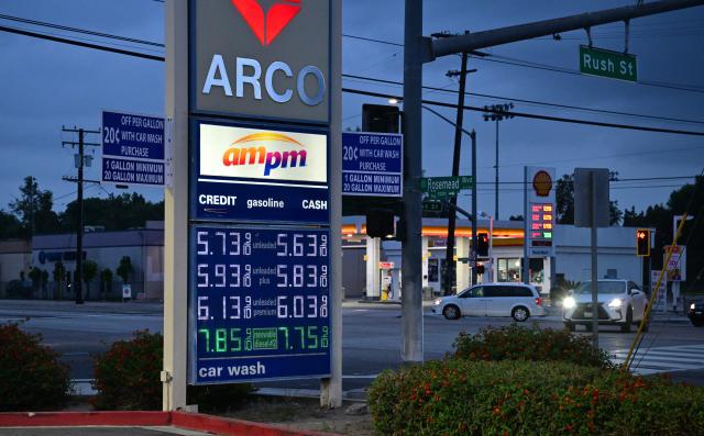 Gas prices are displayed at an Arco station in Rosemead, California, on March 31, 2026, as US gasoline prices reach their highest level since 2022, following a roughly 30 percent increase in recent weeks. Inflation expectations among US consumers surged in March to levels last seen around seven months ago, following rocketing energy prices due to war in the Middle East, survey data showed March 31. The report is being monitored for how American households respond to price pressures as gasoline costs jump after US-Israeli strikes on Iran plunged the region into war. California is home to the nation's highest gas prices, costing some $1.80-$1.90 higher than the US average which just crossed $4.00 per gallon. (Photo by Frederic J. BROWN / AFP)