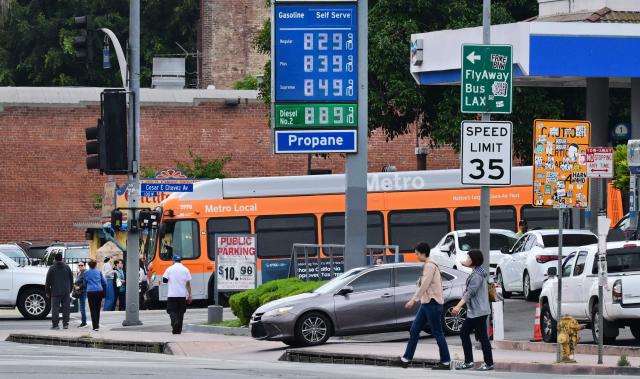 Gas prices are displayed at a Chevron station in Los Angeles, California, on March 31, 2026, as US gasoline prices reach their highest level since 2022, following a roughly 30 percent increase in recent weeks. Inflation expectations among US consumers surged in March to levels last seen around seven months ago, following rocketing energy prices due to war in the Middle East, survey data showed March 31. The report is being monitored for how American households respond to price pressures as gasoline costs jump after US-Israeli strikes on Iran plunged the region into war. California is home to the nation's highest gas prices, costing some $1.80-$1.90 higher than the US average which just crossed $4.00 per gallon. (Photo by Frederic J. BROWN / AFP)