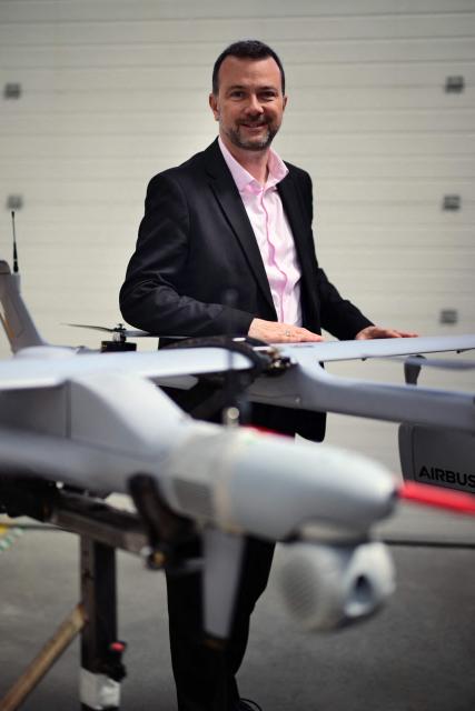 Chairman and CEO of Survey Copter Christophe Canguilhem poses for a portrait at the Survey Copter factory, an Airbus subsidiary in Pierrelatte, southern France on March 31, 2026. At Survey Copter, a French SME integrated into Airbus, the European aerospace corporation is leaning on its know-how in helicopters to develop drones — which have become the sinews of modern warfare — and to make them cooperate with manned aircraft. (Photo by OLIVIER CHASSIGNOLE / AFP)