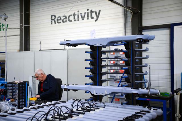An employee works at the Survey Copter factory, an Airbus subsidiary, in Pierrelatte, southern France on March 31, 2026. At Survey Copter, a French SME integrated into Airbus, the European aerospace corporation is leaning on its know-how in helicopters to develop drones — which have become the sinews of modern warfare — and to make them cooperate with manned aircraft. (Photo by OLIVIER CHASSIGNOLE / AFP)