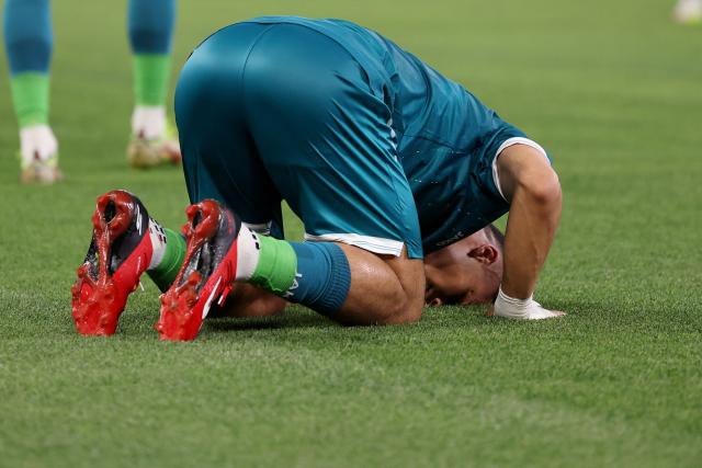 Iraq's forward #09 Ali Al-Hamadi celebrates scoring his team's first goal during the 2026 FIFA World Cup qualifiers final playoff football match between Iraq and Bolivia at the BBVA Stadium in Guadalupe, Nuevo Leon state, Mexico, on March 31, 2026. (Photo by Julio Cesar AGUILAR / AFP)