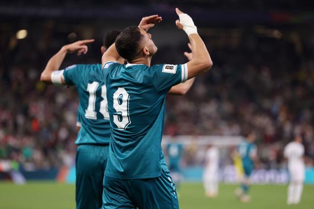 Iraq's forward #09 Ali Al-Hamadi celebrates scoring his team's first goal during the 2026 FIFA World Cup qualifiers final playoff football match between Iraq and Bolivia at the BBVA Stadium in Guadalupe, Nuevo Leon state, Mexico, on March 31, 2026. (Photo by Julio Cesar AGUILAR / AFP)