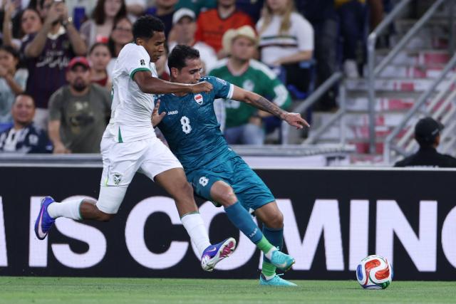 Bolivia's defender #03 Diego Medina (L) and Iraq's midfielder #08 Ibrahim Bayesh (R) fight for the ball during the 2026 FIFA World Cup qualifiers final playoff football match between Iraq and Bolivia at the BBVA Stadium in Guadalupe, Nuevo Leon state, Mexico, on March 31, 2026. (Photo by Julio Cesar AGUILAR / AFP)