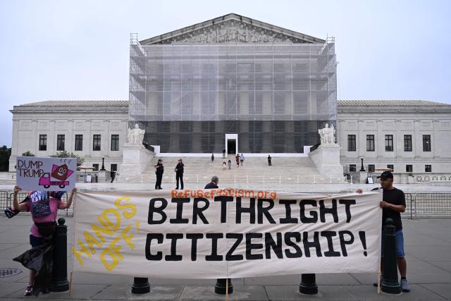 (FILES) Demonstrators holds up an anti-Trump sign outside the US Supreme Court in Washington, DC, on June 27, 2025. President Donald Trump will watch the US Supreme Court hear a landmark case April 1, weighing the constitutionality of his contentious bid to end birthright citizenship -- an extraordinary and possibly unprecedented move for the nation's highest office. Trump signed an executive order on his return to the White House decreeing that children born to parents in the United States illegally or on temporary visas would not automatically become US citizens. (Photo by Alex WROBLEWSKI / AFP)