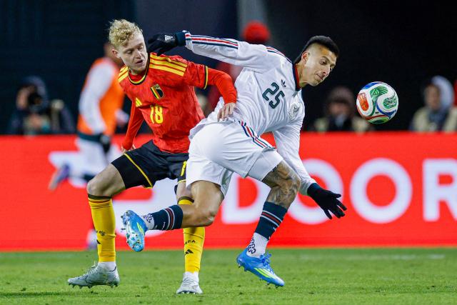 Belgium's defender #18 Joaquin Seys and Mexico's forward #25 Roberto Alvarado battle for the ball during a friendly football match between Mexico and Belgium at Soldier Field in Chicago, Illinois, on March 31, 2026. (Photo by KAMIL KRZACZYNSKI / AFP)