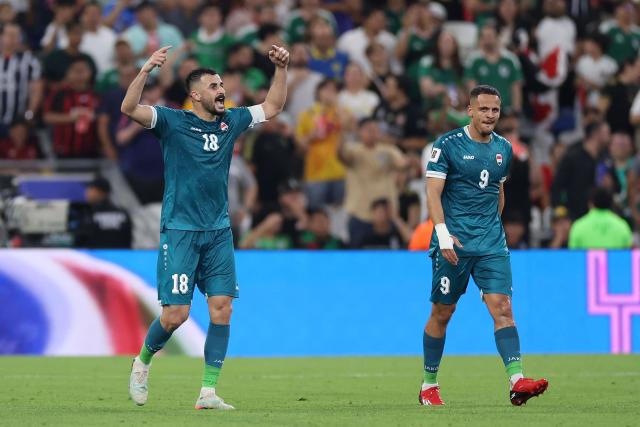 Iraq's forward #18 Aymen Hussein celebrates scoring his team's second goal during the 2026 FIFA World Cup qualifiers final playoff football match between Iraq and Bolivia at the BBVA Stadium in Guadalupe, Nuevo Leon state, Mexico, on March 31, 2026. (Photo by Julio Cesar AGUILAR / AFP)