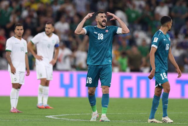 TOPSHOT - Iraq's forward #18 Aymen Hussein celebrates scoring his team's second goal during the 2026 FIFA World Cup qualifiers final playoff football match between Iraq and Bolivia at the BBVA Stadium in Guadalupe, Nuevo Leon state, Mexico, on March 31, 2026. (Photo by Julio Cesar AGUILAR / AFP)