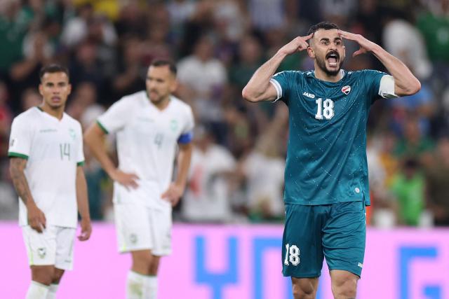 Iraq's forward #18 Aymen Hussein celebrates scoring his team's second goal during the 2026 FIFA World Cup qualifiers final playoff football match between Iraq and Bolivia at the BBVA Stadium in Guadalupe, Nuevo Leon state, Mexico, on March 31, 2026. (Photo by Julio Cesar AGUILAR / AFP)