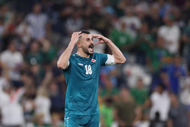 Iraq's forward #18 Aymen Hussein celebrates scoring his team's second goal during the 2026 FIFA World Cup qualifiers final playoff football match between Iraq and Bolivia at the BBVA Stadium in Guadalupe, Nuevo Leon state, Mexico, on March 31, 2026. (Photo by Julio Cesar AGUILAR / AFP)